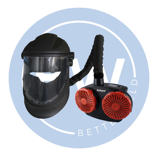 Black protective mask with clear visor and red filter on a light blue background